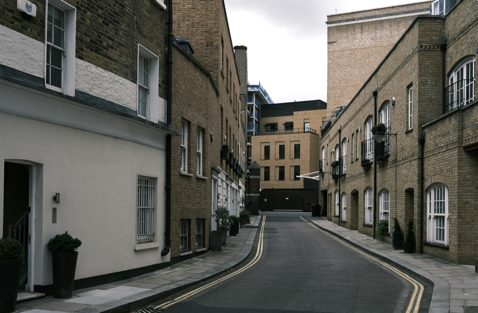 Brick-built commercial buildings on a quiet mews street