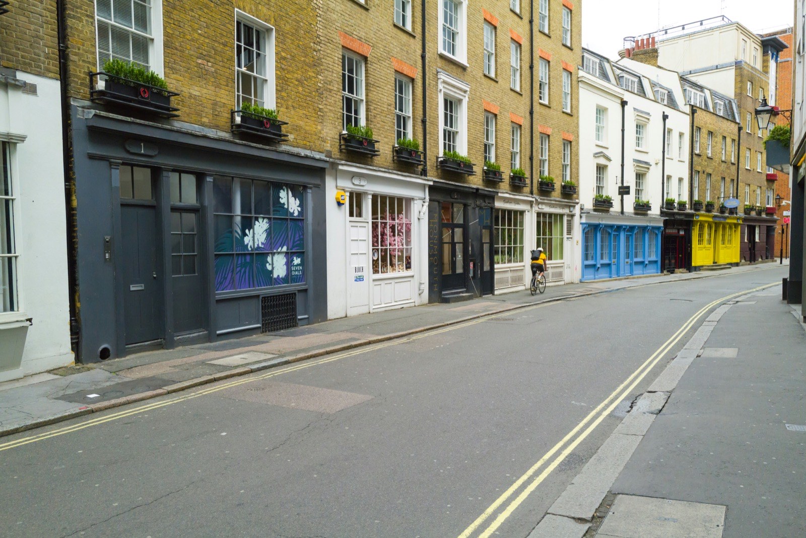 Colourful shopfronts along a city street